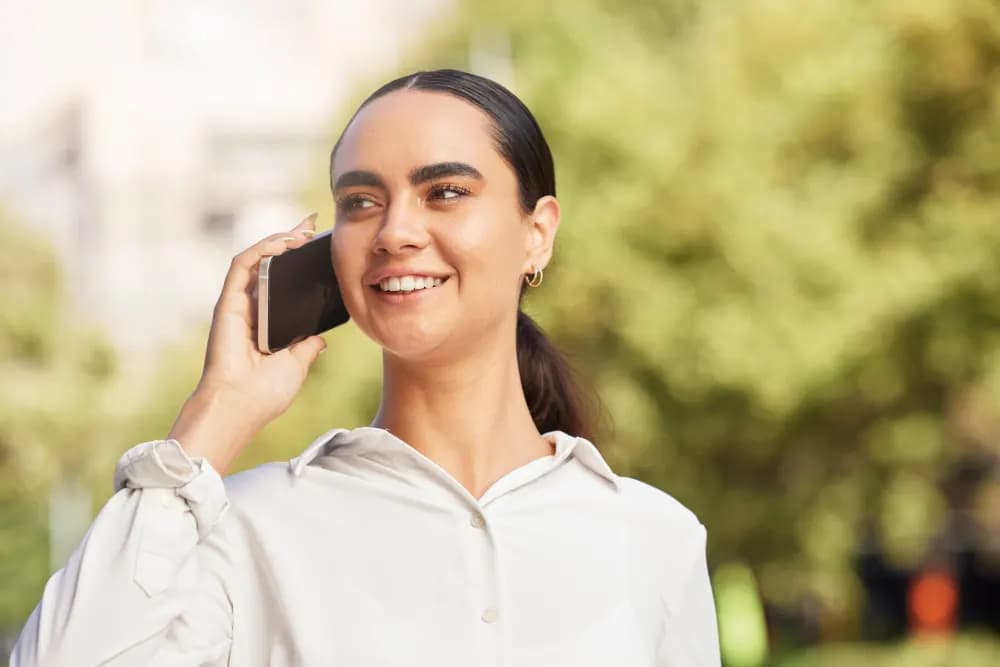 Woman talking on her phone outdoors