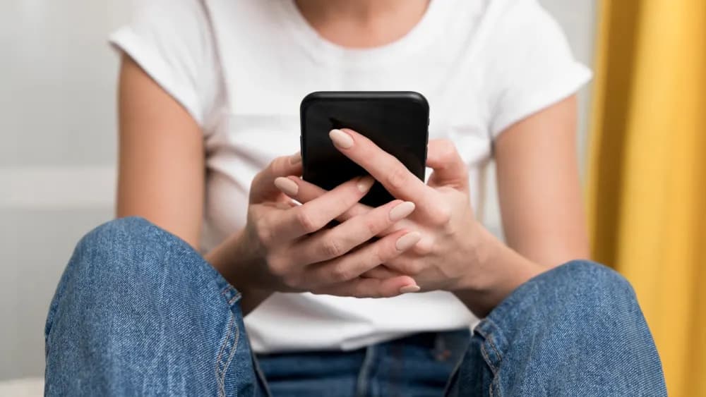 Person holding a phone with both hands