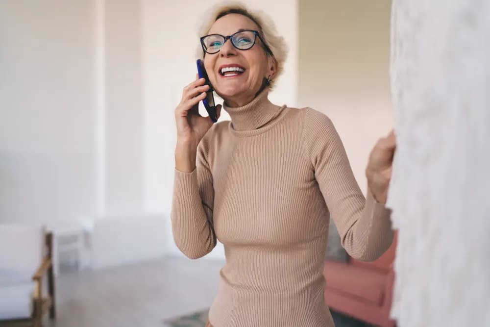 Older woman laughing on the phone